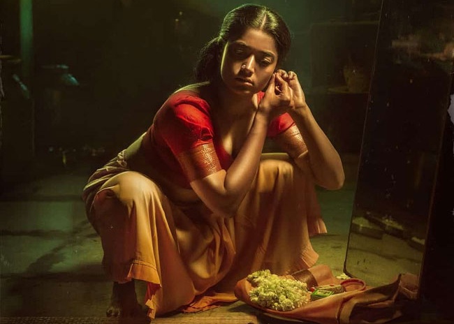 Rashmika in a striking pose in her first look from Pushpa
